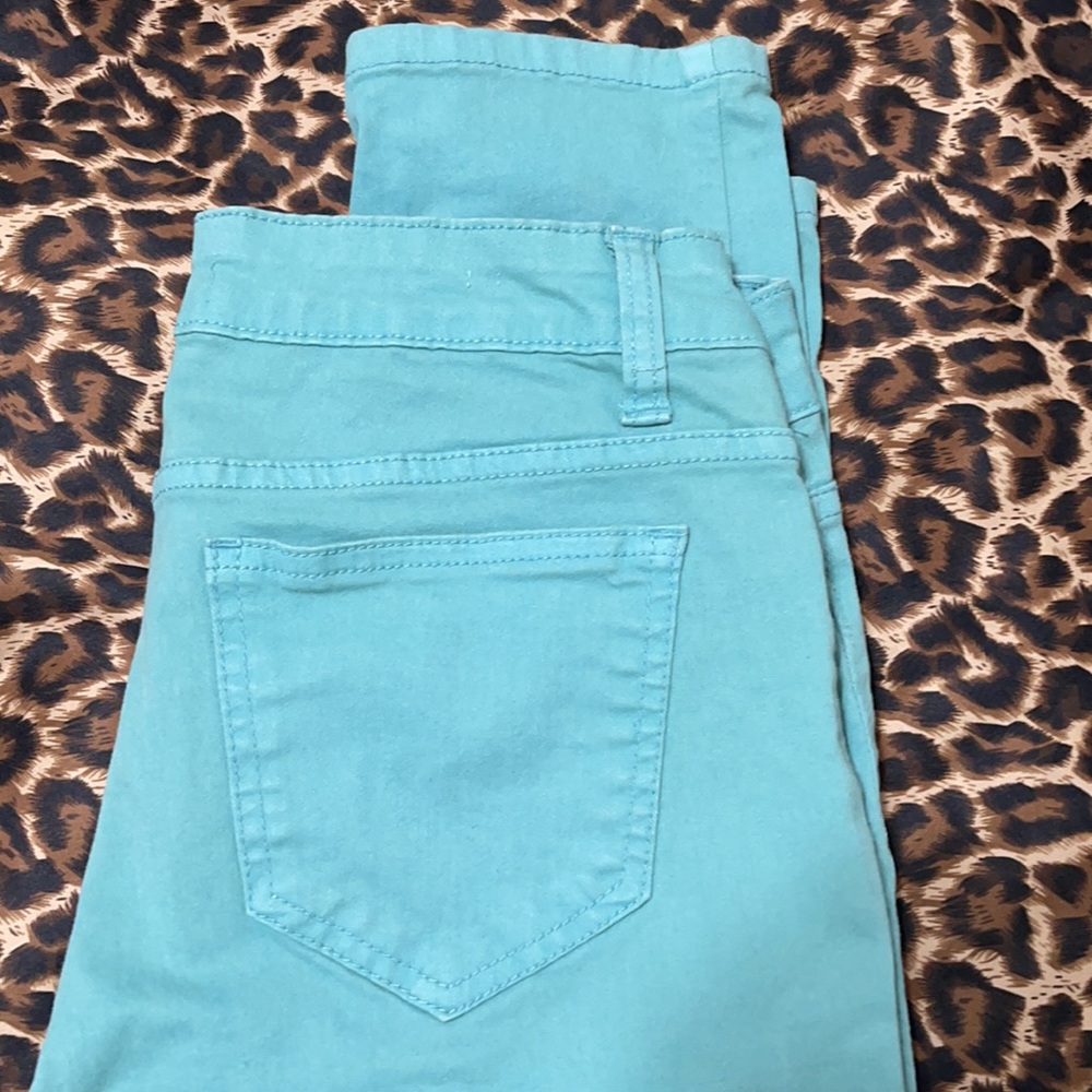 Mid rise teal skinny jeans size 7
